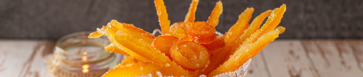 yellow flower in clear glass vase on white table
