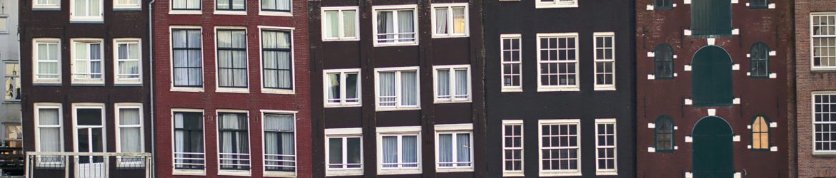 assorted-color houses under white sky